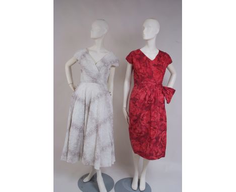 A 1950'S NORMAN HARTNELL SILK DAY DRESS A beautiful tulip shaped, soft silk, rose red silk summer frock.  The dress has been 