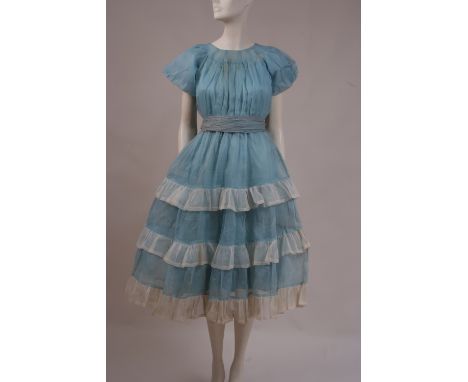 A 1940'S ORGANDIE PARTY DRESS A very pretty light blue organdie party dress, handmade, with puff sleeves,  tiered frills of w