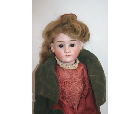 BISQUE HEAD DOLL - MAX HANDWERCK with weighted brown eyes and open mouth, with a crack on one side of the head. Marked, Max H