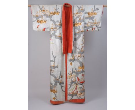 A LATE C19TH CENTURY JAPANESE WEDDING KIMONO. A damask cream silk kimono woven with flower symbols and hand embroidered with 