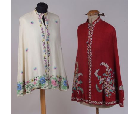 TWO 1940'S EMBROIDERED KASHMIR CAPES. A dark plum red cashmere wool cape embroidered with colourful flowers in chain stitch. 