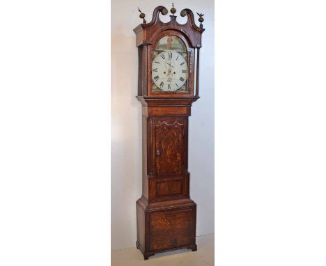 A 19th century oak longcase clock. With double ogee arched pediment with brass scroll ends and finials. Varying cross banding