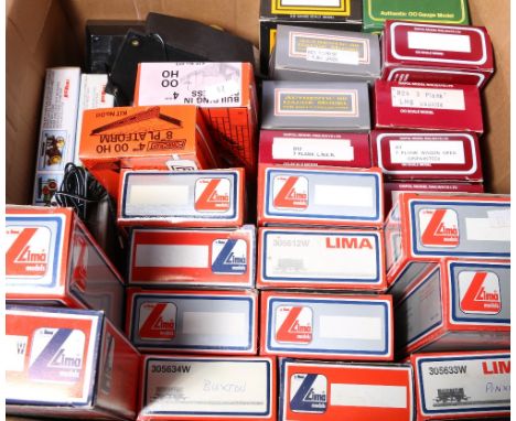 OO gauge model railways: thirteen Lima wagons, boxed; eight Dapol wagons, boxed; layout, kits etc.