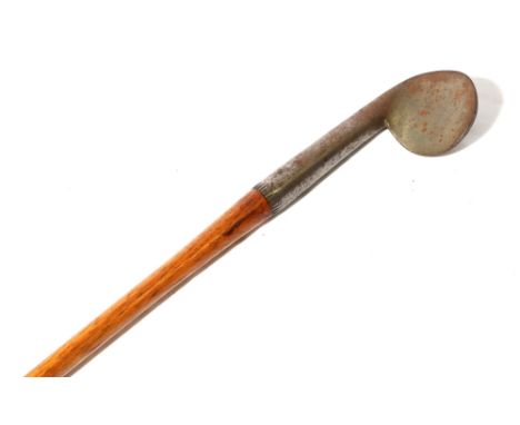 Unusual hickory shafted rut iron with circular smooth-faced head, stamped indistinctly to the reverse, possibly John Gray of 