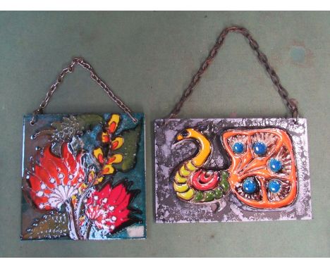 Two West German ceramic wall plaques, peacock and floral design.  23.5cm x 37.5cm and 30cm x 30cm