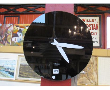 A Karlsson mirage black glass mirror wall clock, 40cm diameter 