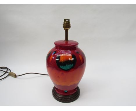 A Poole volcano glaze lamp base on wooden plinth, 34cm total height