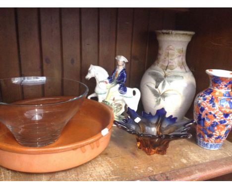 SHELF OF POTTERY AND A GLASS BOWL