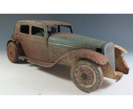 A Large Scale Mettoy Clockwork Tinplate Car in blue and cream in poor condition and motor does not work (37cm approx). 