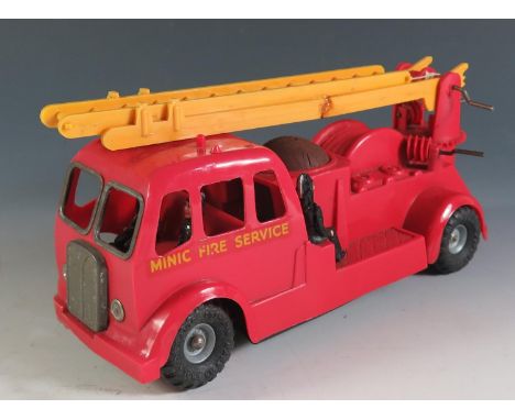 A Triang Minic Plastic Fire Engine  with Push n' Go Motor. 210mm approx. 