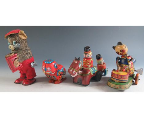 Four Clockwork Tinplate Toys Including a Drumming Pander, Accordian playing bear, Robot and Guardsman and Horse made by Mikun