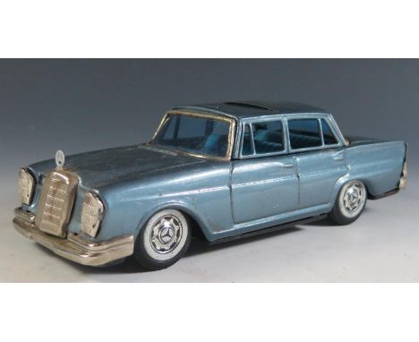 A Scarce Tinplate Bandai Mercedes Benz 230 in Light Metallic Blue Made in Japan (21cm approx). 