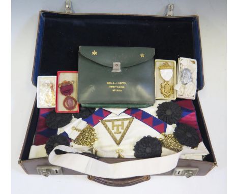 A Case of Masonic Regalia including apron, sash, 'jewels' etc. 