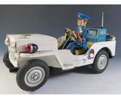 A Large Scale Battery Operated Jeep Made by Nomura in Japan (35cm approx) (Untested). 