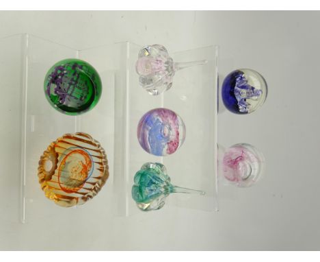 Seven Caithness paperweights; 'Sea Pearl', 'Brave Heart', 'Miniature Moon Flower' and four others (7)   Condition Report   Cl