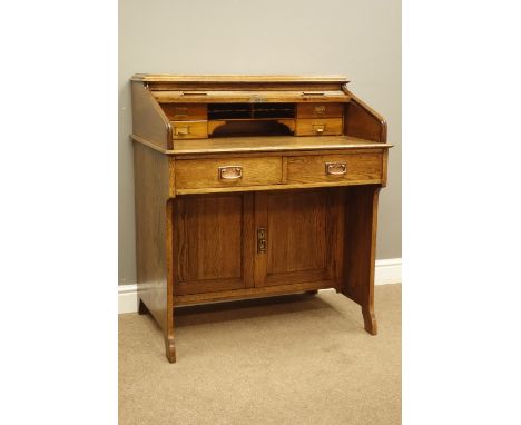 Early 20th century 'The Lebus Desk' oak tambour roll top desk, interior fitted with drawers and pigeon holes, two drawers, pa