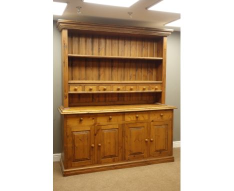 Large traditional pine kitchen dresser, four drawer above four panelled doors, plate rack with spice drawers, W183cm, H216cm,