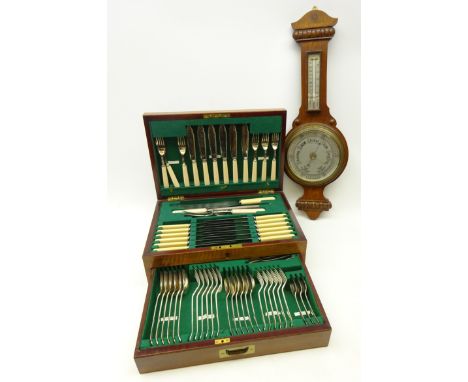 Canteen of Frank Cobb & Co. silver-plated rat tail pattern cutlery in a inlaid mahogany and brass abound canteen, six place s