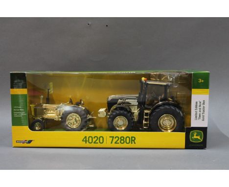 A boxed Britain's John Deere limited edition "Then and Know" gold tractor duo 4020/7280R