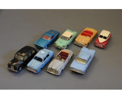 A group of 8 Dinky and Corgi diecast model cars consisting of a 2 tone 159 Morris Oxford, a 418 Auction London Taxi, a two to