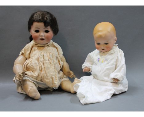 An early 20th century William Goebel bisque head doll and an Armand Marseille 352/4K bisque head baby doll. Both having open 