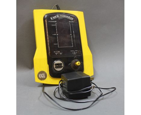 A 1980's retro "Puck Monster" Pac-Man style hand held gaming console, in working order, and with sound effects 