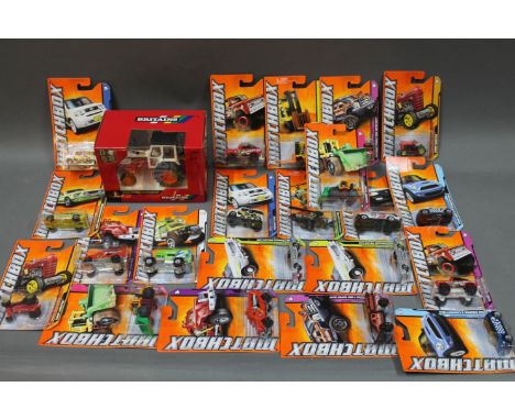 A boxed Britain's 1:32 scale David Brown 1412 tractor and 21 modern matchbox die cast model vehicles 