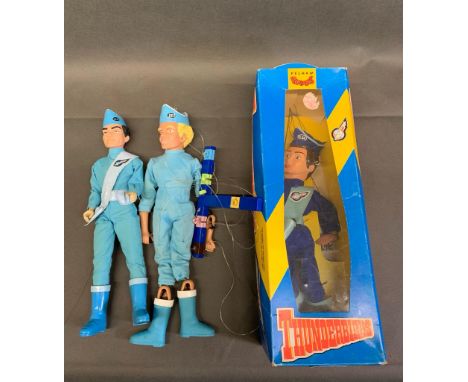A Carlton Thunderbirds doll together with a Thunderbird puppet of Alan and a Pelham Puppets boxed Thunderbirds doll