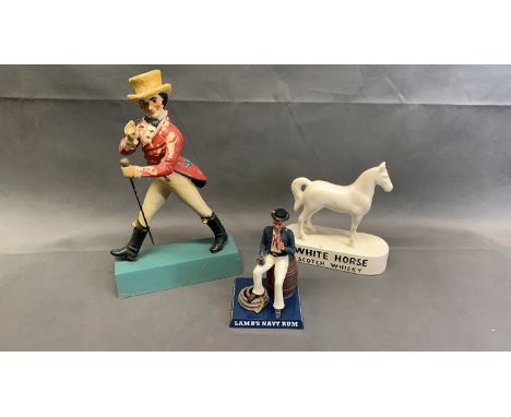 A vintage Johnnie Walker advertising model, together with Lambs Navy Rum and a Whitehorse Scotch Whiskey model