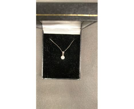 A 9 carat white gold chain and pendant, set with diamond cluster. 1.3 grams