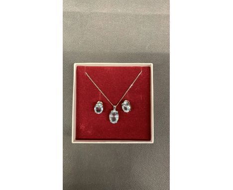 A white gold chain and matching earings, set with aquamarine