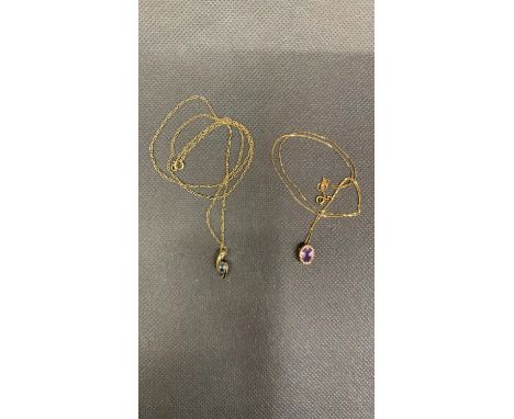 A 9 carat yellow gold chain and pendant, set with amethyst, together with a 9 carat yellow gold chain and pendant set with to