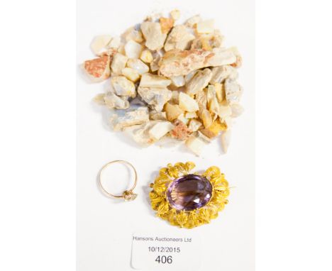 A small bag of uncut/polished sample gems to include opal, a filigree yellow metal and amethyst brooch (af) and a yellow meta