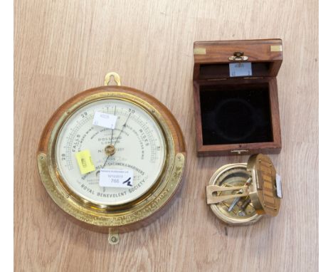 A Dollond London Marine Aneroid barometer (no. 1221) with a boxed brass Stanley travel compass, incorporating a spirit level 