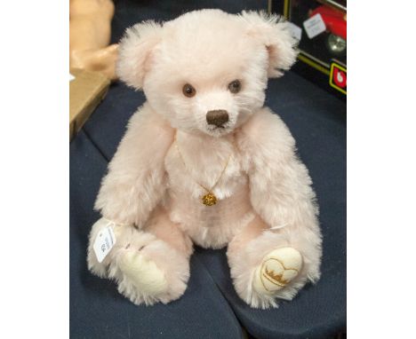 A modern pink Steiff teddy bear, label cut, button in ear, wears a flower pendant necklace embroidered crown to foot, height 