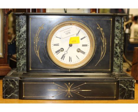 A Victorian slate clock with key wooden