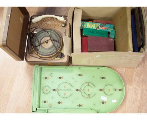 A bagatelle board a Regentone record player ad a box of vintage games and books
