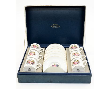 A boxed Royal Worcester coffee set comprising six coffee cans and saucers 
