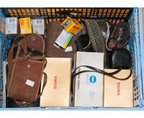 A quantity of cameras a Minolta 500 SI, a Kodak expanding camera and case, lenses, films, cases, straps etc 