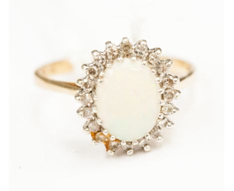 An opal and diamond ring, the shank stamped 375