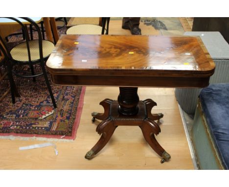 An early 19th century mahogany card table