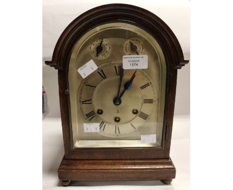 An early Twentieth Century bracket or table clock - chime GB maker, silvered dial, mahogany casing with key mounted on ball f