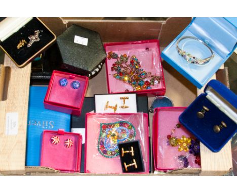 A good quantity of assorted boxed costume jewellery to include a silver bangle and bracelet, Butler and Wilson coloured glass