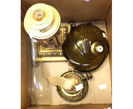 A classical style functioning oil lamp, gilded metal with key and classical decorations