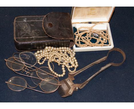 A leather case with Victorian 9ct gold framed spectacles and pinz nez; together with Army (19th Century) hair clippers and tw