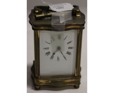 A carriage clock gilt brass, enamel dial (key) 