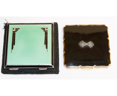 An Art Deco silver and enamelled square compact, having black enamel border,m guilloche green enamel with geometric black ena