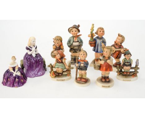 A collection of eight Goebel Hummel figures and a Guide for Collectors, together with two small Royal Doulton figures 'Victor