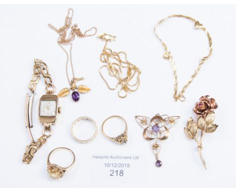 A two colour gold 'Rose' brooch set ruby to the centre, stamped 9ct, a floral leafage pendant set oval amethyst and an Edward