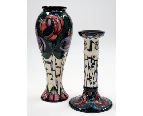 A Moorcroft Mackintosh rose design vase, elongated inverse baluster form, together with a candlestick in the same design, cir